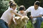 Family washing dog