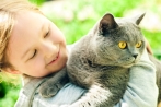 Girl holding cat